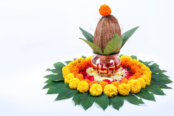 Copper Kalash with coconut , leaf and floral decoration on a white background. essential in hindu...