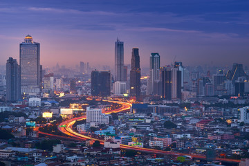sweet twilight of cityscape with s-curve of expressway