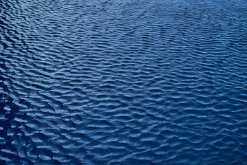 texture of navy blue ripple on swimming pool