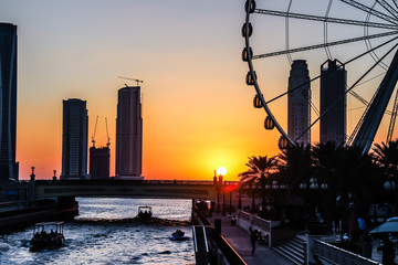 Eye of Sharjah sunset silhouette Emirates