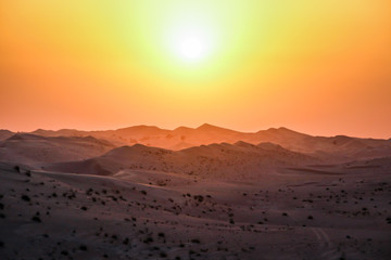 Fototapeta na wymiar Dubai Emirates sand dunes sunset