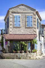 Vertical shoot of masonry mediterranean house under bright sun