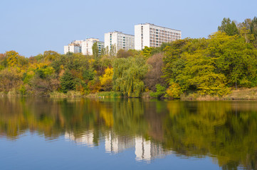 Fototapeta na wymiar Urban Autumn landscape with trees in sunlight