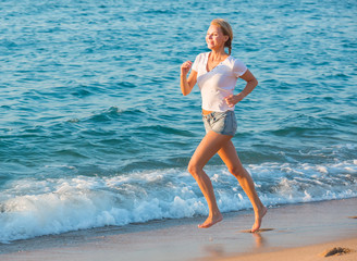 Female in white T-shirt is jogging