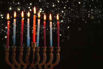 image of jewish holiday Hanukkah background with menorah (traditional candelabra) and candles.