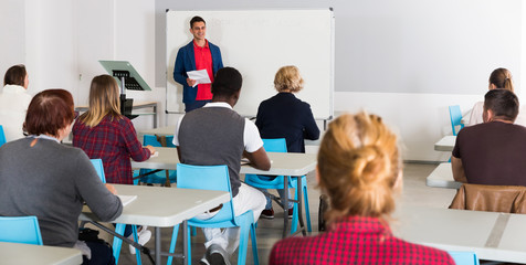 Male teacher lecturing to students