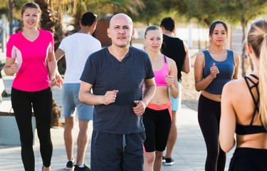 Fototapeta na wymiar Active people during running training