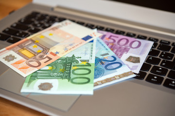computer keyboard with euro bank notes