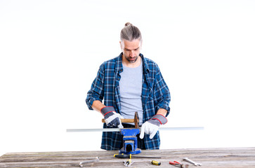 worker in blue  shirt working with metal