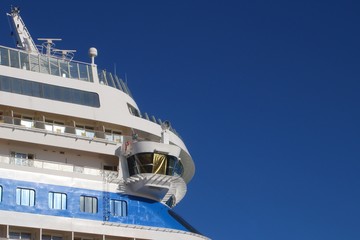 Ship's bridge of a cruise liner against blue sky - side view