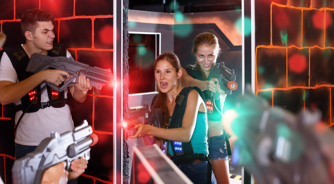 Jolly  Laser tag players playing in teams