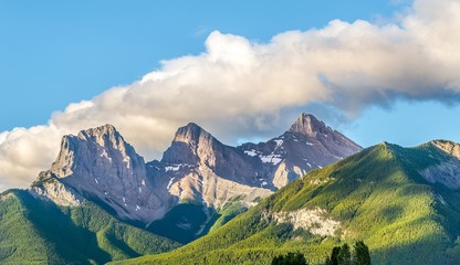 Morning view at the Three Sisters mountains from Canmore in Canada