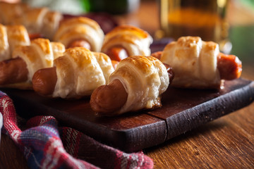 Pigs in blankets. Dark mood