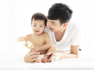 happy asian young father and  baby