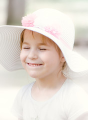 little girl in Hat smiling