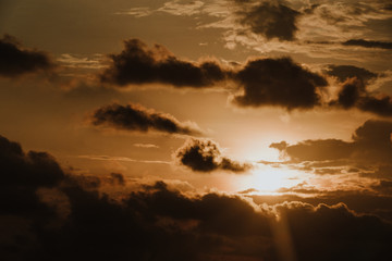 Naklejka na ściany i meble Dusk til dawn | Sunset sky on the beach | Sun with dark clouds
