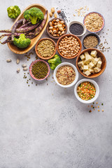 Vegan protein source. Tofu, beans, chickpeas, nuts and seeds on a white background, top view, copy space.