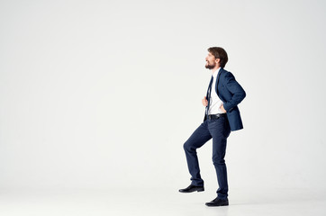 Fototapeta na wymiar man on a light background in a classic suit