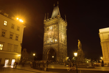 East bridge tower of the Charles Bridge in the night landscape. Prague