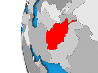 Afghanistan on blue political 3D globe.