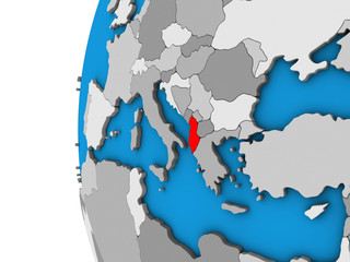 Albania on blue political 3D globe.