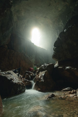 Mysterious cave, Tourist in the Occidental Carpathians, Radesei Cave, Apuseni Mountains, Romania