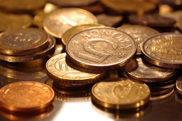 photo of metal coins of different currencies