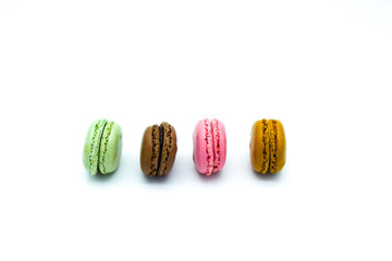 macarons isolated on white background, sweet colorful macarons in row