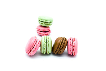 macarons stacked and in row, sweet colorful macarons on white background