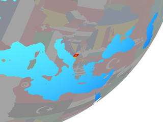 Montenegro with embedded national flag on blue political globe.