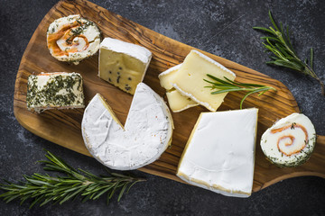Cheese platter on dark stone table.