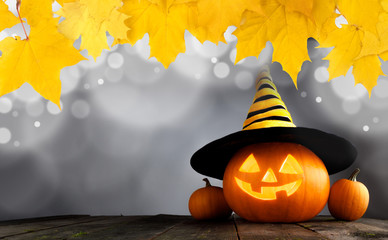 Halloween pumpkin with witches hat