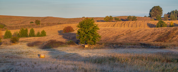 panorama of fields and meadows on a magnificent misty and sunny morning. landscape picture resembling Italian Tuscany. Autumn, Poland, Drawsko Lake District