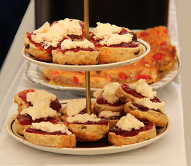 A Display of Freshly Made Jam and Cream Scones.