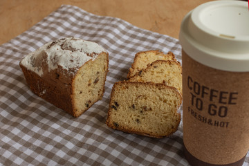 Sweet cake and coffee to go. Homemade bun.