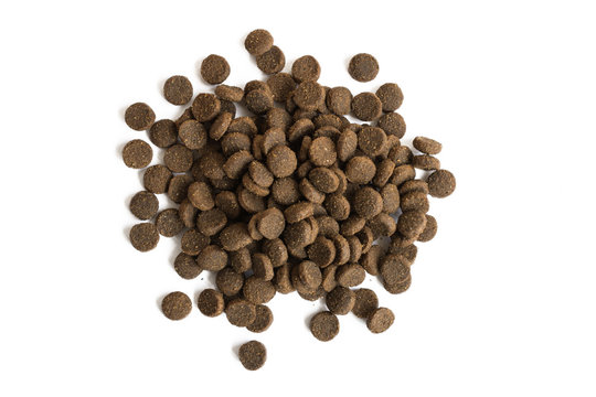 Heap of dog's food isolated on white background. Healthy pet's crunchy food.