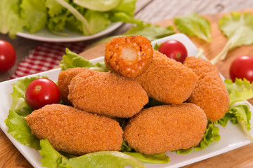 Supplì, italian fried rice balls.