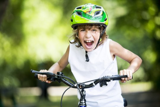 Boy sitting on bicycle
