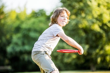 Boy throwing flying disc