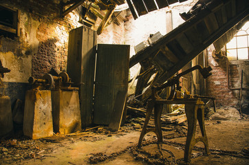 Machines in a old factory in the Netherlands that was used in the early 50's. This factory was used to make roof tiles, and now it is abandoned for a long time.