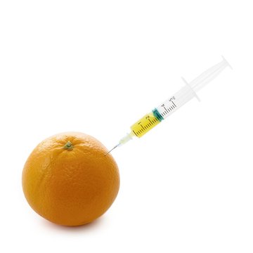 Orange with syringe