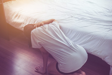 Woman bent and searching something under bed lost thing