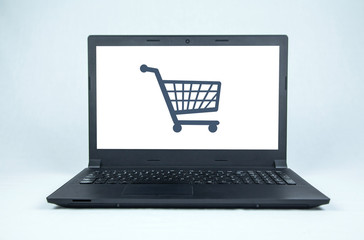 Shopping icon on laptop screen. Online shopping