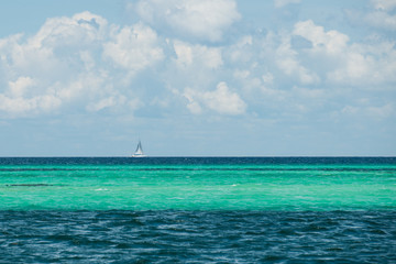 Fototapeta na wymiar Line of turquoise water at Caribbean sea near the Saona island