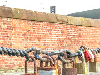 Walk on pier with chains and many locks on it
