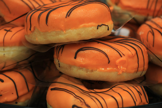 Orange iced donuts