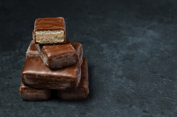 Chocolate candy on a dark background. Close up. Copy space
