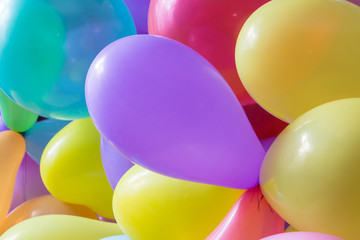 background colored balloons,bright bunch of Colorful balloons. Background, low depth of focus.