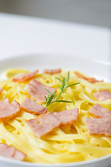 Closeup pasta carbonara with ham and cheese