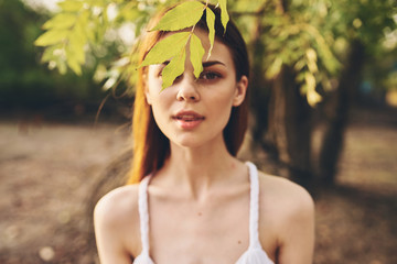 woman on nature in a bright shirt